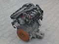 Silnik Alfa Romeo 156, gotowy do montażu. Widoczny koło zamachowe i elementy układu dolotowego.