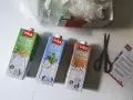 Trzy kartony napojów roślinnych Inka: ryżowy, sojowy i owsiany. Obok nożyczki i ulotka. Tak powstaje mleko owsiane.