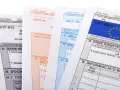 Formularze podatkowe, w tym CIT-8/O, VAT-R, VAT-7K i VAT-UE/C, z widocznymi polami na numer identyfikacyjny podatnika (NIP) i numer VAT.