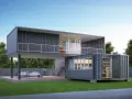 Une maison conteneur moderne à deux étages avec terrasse, escaliers extérieurs et mobilier de jardin.