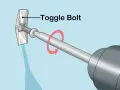 Utilisation d'un boulon à bascule pour accrocher un miroir au mur. La vis est insérée dans le mur et le mécanisme à bascule s'ouvre derrière la cloison sèche.