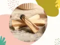 Drewno palo santo, znane z właściwości oczyszczających i relaksujących, leży na kamiennym blacie.
