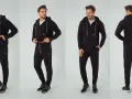Mężczyzna prezentuje czarny komplet dresowy męski z kapturem i zamkiem. Wygodny i stylowy, idealny na co dzień.