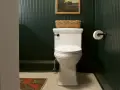 A white toilet with a basket on top, ready for a tutorial on how to replace toilet seat.