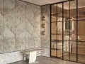 Ingresso con boiserie moderne imbottite, panchina in legno e rattan, e cabina armadio a vista con illuminazione integrata.