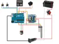 Schemat połączeń Arduino z elementami sterującymi: przełączniki, diody, silnik, akumulator.