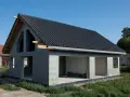 Dom w stanie surowym w Poznaniu, z czarnym dachem i szarymi ścianami z bloczków.