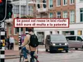 Ciclista ignora il semaforo rosso, rischiando una multa salata e la sospensione della patente, come previsto dall'art. 146 del Codice della Strada.