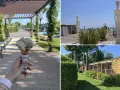 Lody na patyku i plażowe rzeźby na Marina di Venezia Camping. W tle widać domki kempingowe i alejkę.
