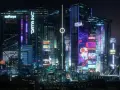 Noche futurista con rascacielos iluminados por neones, anuncios digitales y la silueta de una ciudad que evoca la actualización cyberpunk 2077.