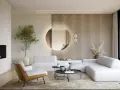 Nowoczesny salon z białymi sofami, kominkiem i okrągłym lustrem Kent, które dodaje elegancji.