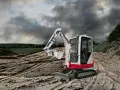 Mini koparka Takeuchi TB216 na budowie, gotowa do pracy. Sprawdź Takeuchi TB216 dane techniczne.