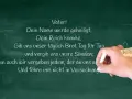 Kreidetafel mit Teilen des Vaterunsers. Eine Hand schreibt "Vater! Dein Name werde geheiligt. Dein Reich komme. Gib uns unser täglich Brot Tag für Tag und vergib uns unsre Sünden; denn auch wir vergeben jedem, der an uns s Und führe uns nicht in Versuc...