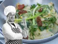 Chef approva scaloppine al limone cremose, un piatto invitante con limone, pomodori secchi e prezzemolo.