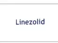 Niebieski napis "Linezolid" na białym tle. Linezolid to antybiotyk.