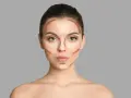 Modelka pokazuje, gdzie nakładać bronzer i rozświetlacz, by wymodelować twarz.