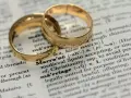 Two gold wedding rings rest on a dictionary page, highlighting the definition of "marriage" and its contrast to sexual immorality.