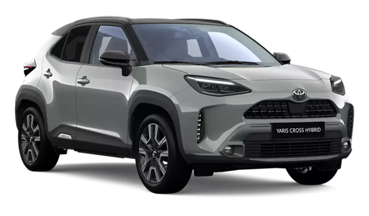 Srebrny Toyota Yaris Cross Hybrid z czarnym dachem, prezentujący nowoczesny design i hybrydowy napęd.