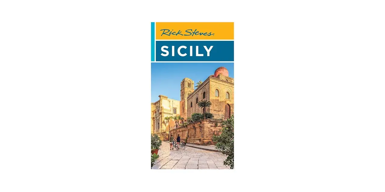 Rick Steves Sicily: A sun-drenched street in Sicily with ancient architecture and two people on bicycles, hinting at an unforgettable journey.
