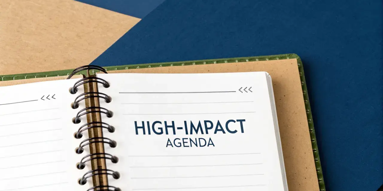 A notebook open to a page titled "HIGH-IMPACT AGENDA," ready for a productive board meeting.