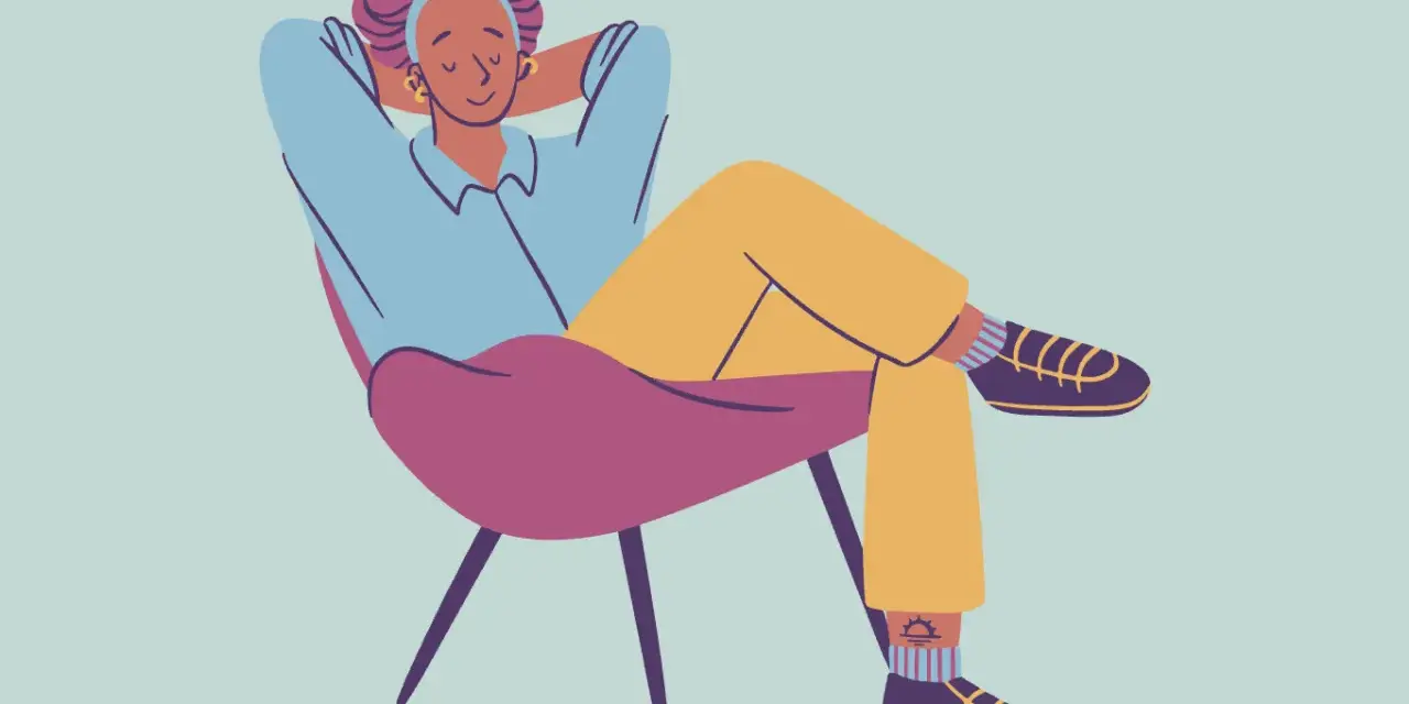 A person relaxes in a chair, hands behind their head, demonstrating how to decompress.