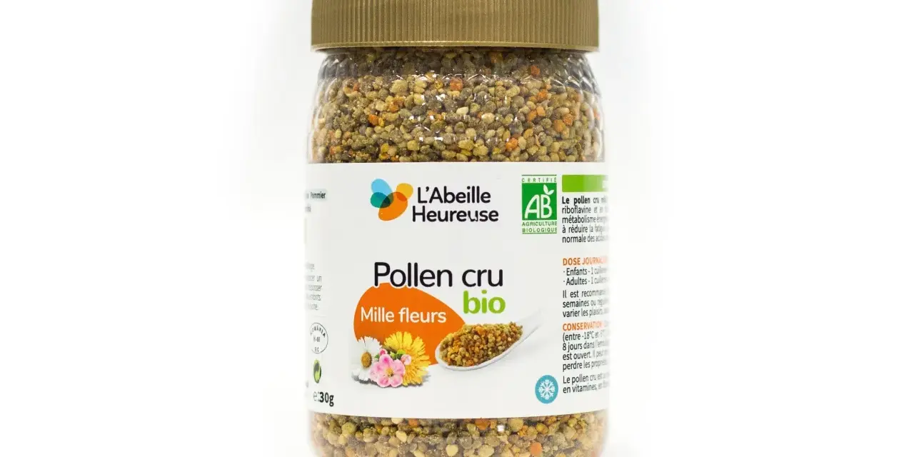 Un pot de pollen cru mille fleurs bio de L'Abeille Heureuse, rempli de granules dorés et orangés.