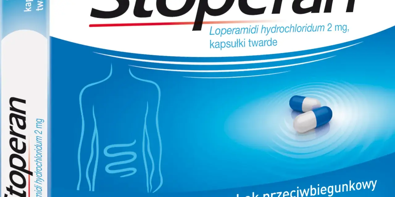Opakowanie leku Stoperan, zawierające 8 kapsułek twardych. Na niebieskim tle widnieje schemat układu pokarmowego i dwie kapsułki.