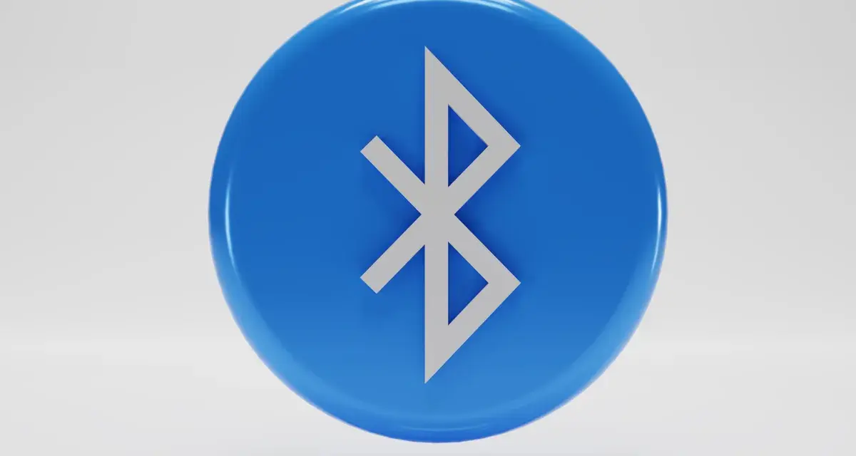 Niebieski okrąg z symbolem Bluetooth. Tak działa bezprzewodowe połączenie między urządzeniami.