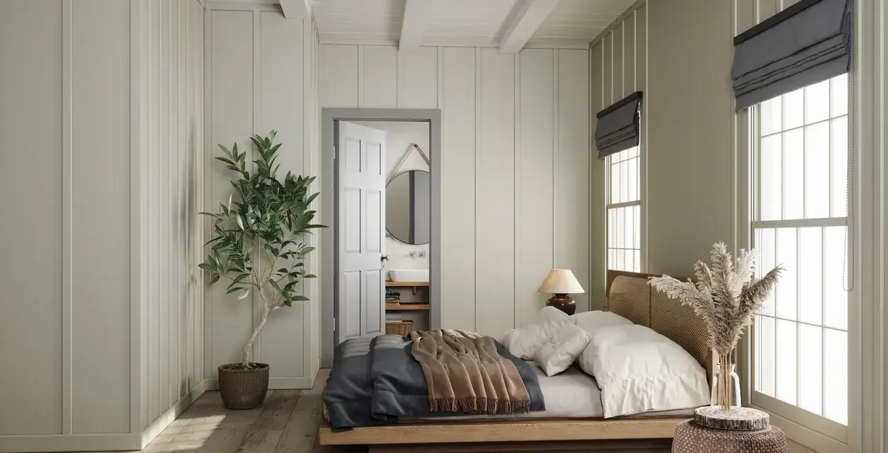 Camera da letto con letto in legno, la sua posizione rispetto alla porta aperta che rivela un bagno.