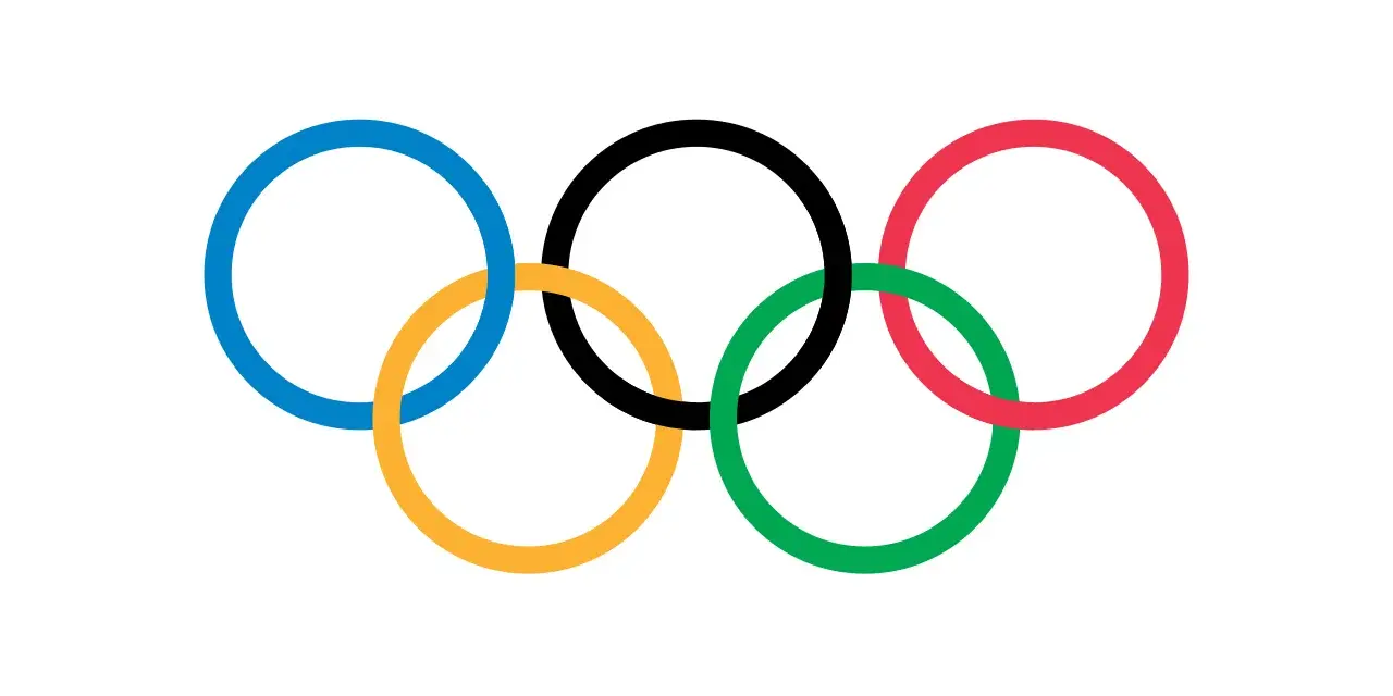 Pięć splecionych kół symbolizujących jedność i ducha sportu - flaga olimpijska.