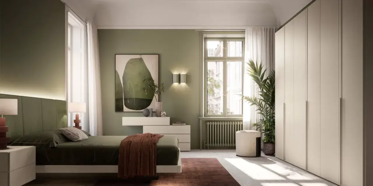 Camera da letto con pareti verdi e un letto accogliente. L'arredamento verde crea un'atmosfera rilassante, con un quadro astratto e un grande armadio bianco.