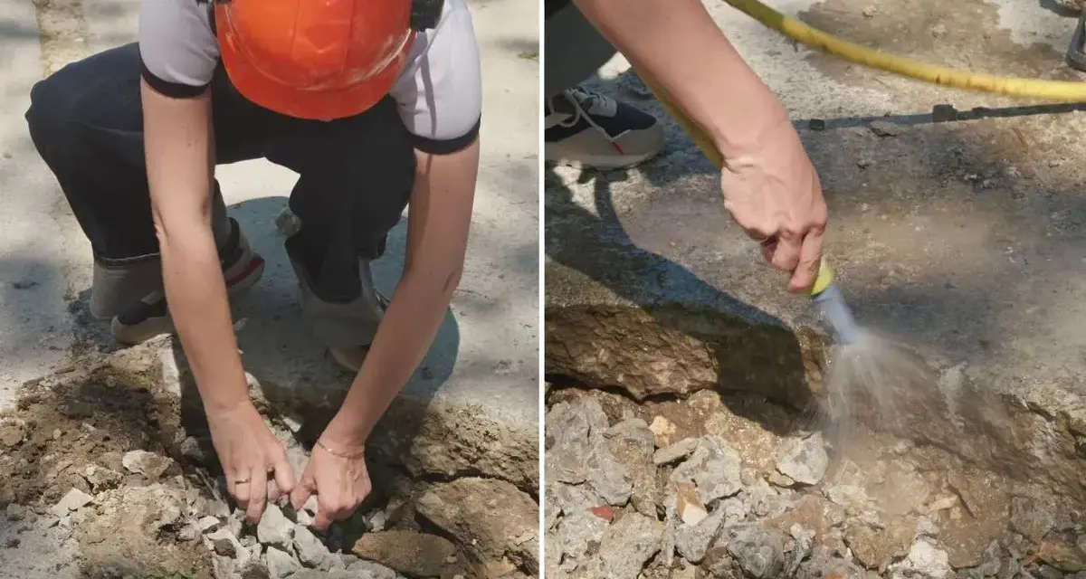Preparando el área para reparar suelo de hormigón exterior. Se retiran escombros y se humedece la zona.