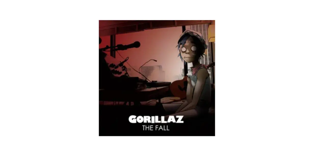 Okładka albumu Gorillaz The Fall. 2D siedzi przy stole z gitarą i sprzętem muzycznym.