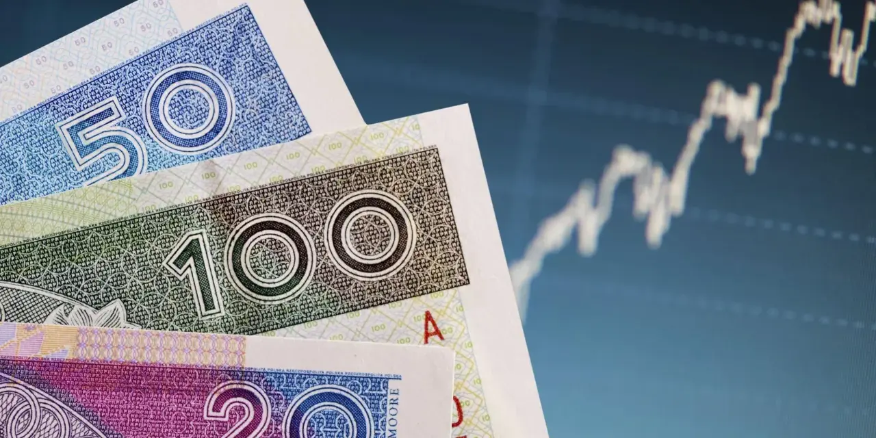 Polskie banknoty 20, 50, 100 zł na tle wykresu giełdowego. Bankowy fundusz gwarancyjny chroni depozyty w bankach.