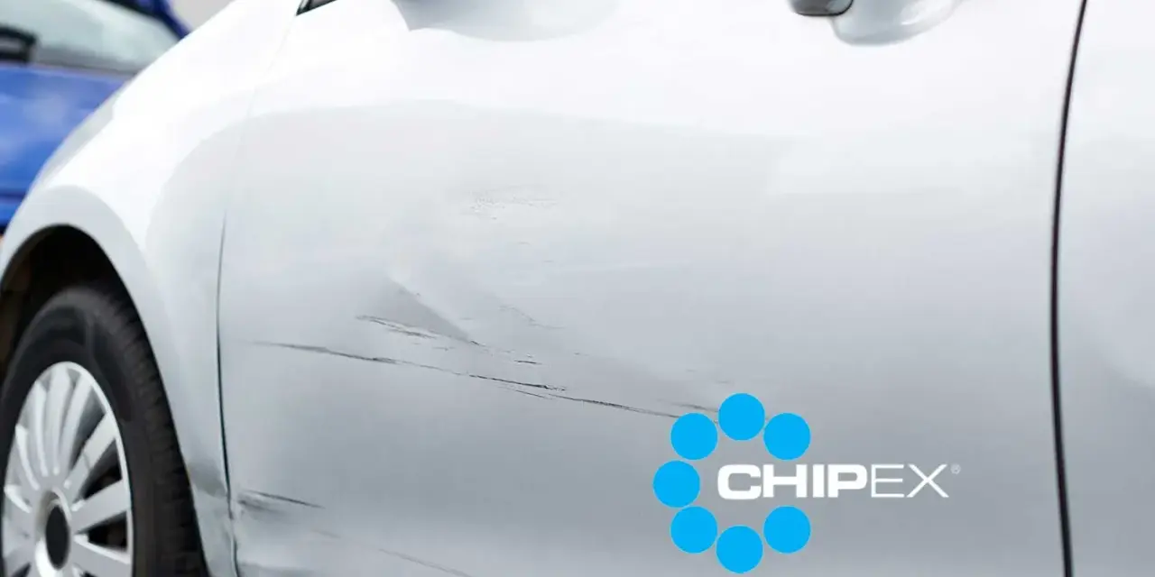 Scratches on a silver car door, with a CHIPEX logo. Can you buff out scratches like these?