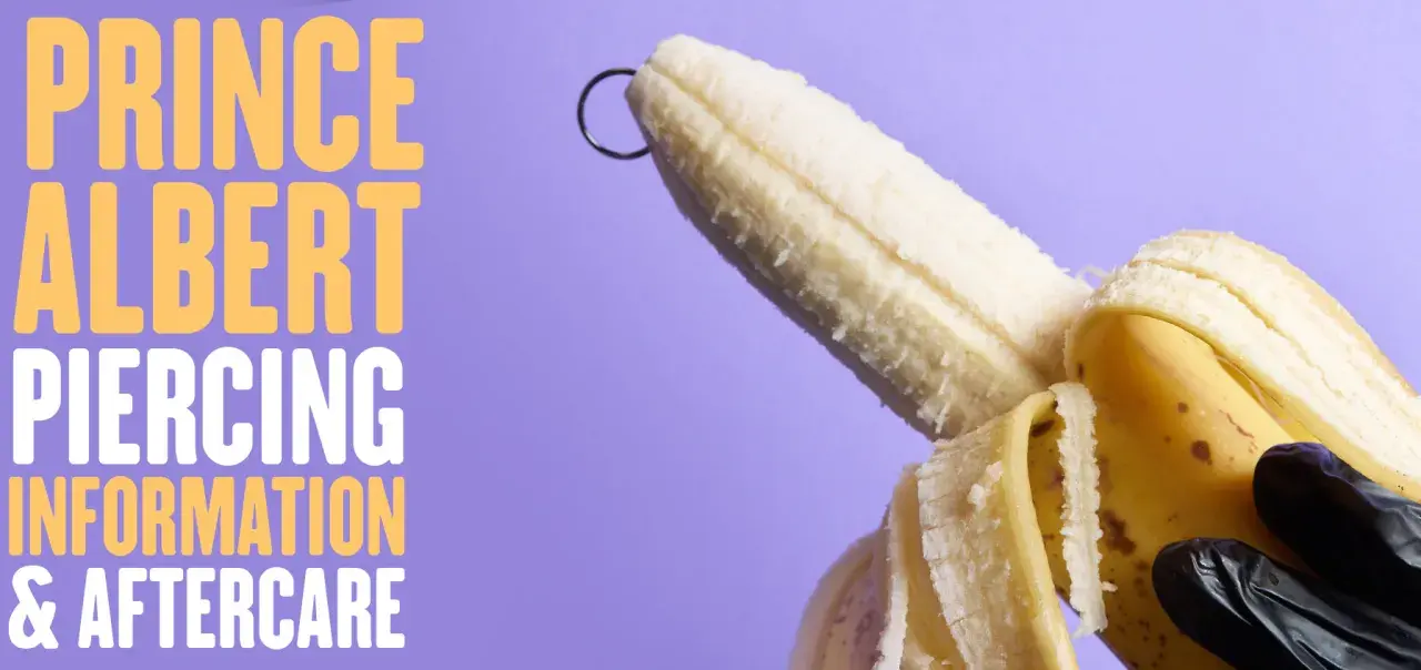 Banan z kółkiem, symbolizującym kolczyk w chuju, na fioletowym tle. Tekst: "PRINCE ALBERT PIERCING INFORMATION & AFTERCARE".