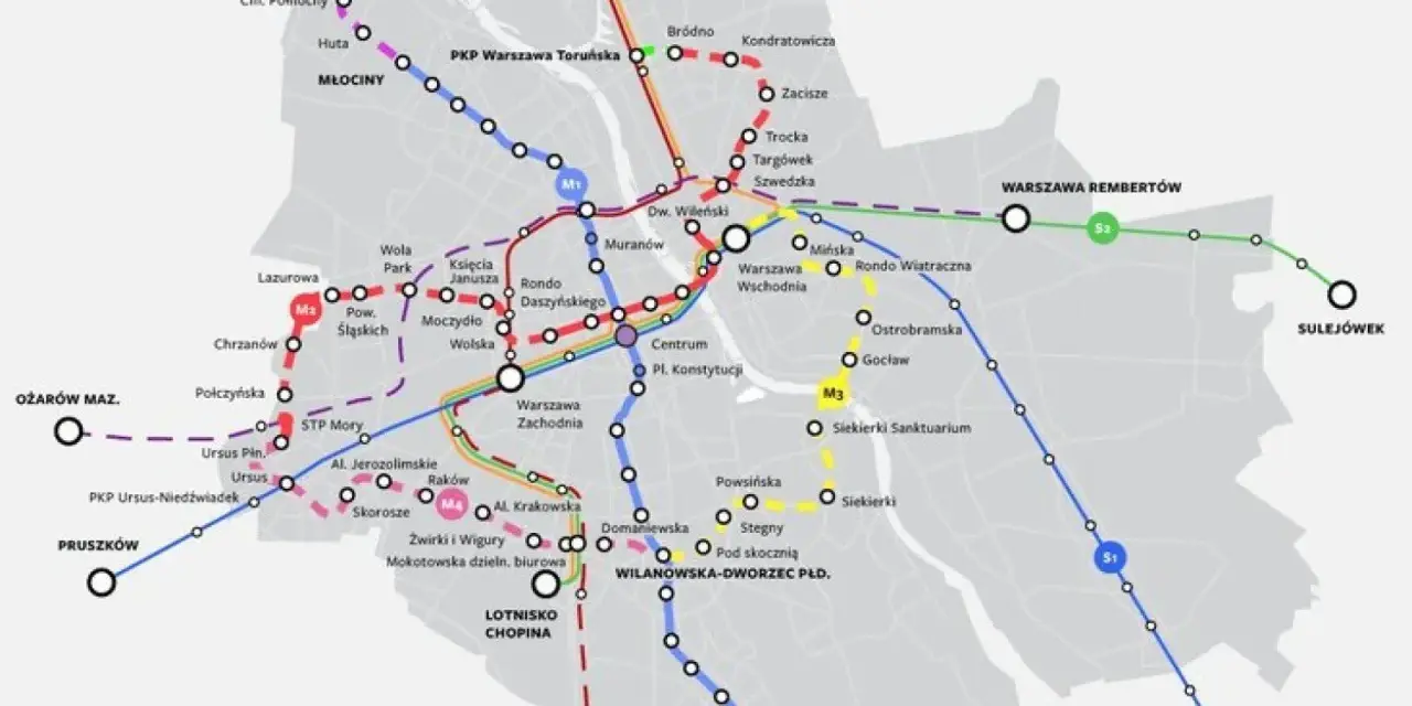 Mapa pokazuje stacje metra M2 i inne linie kolejowe w Warszawie, z zaznaczonymi trasami i nazwami przystanków.