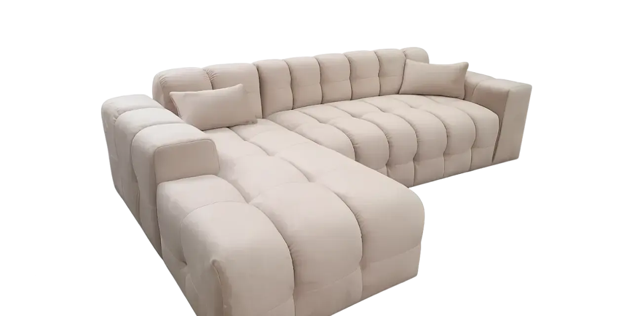 Elegancki narożnik York w jasnym kolorze, z pikowanymi poduchami, idealny do nowoczesnego salonu.