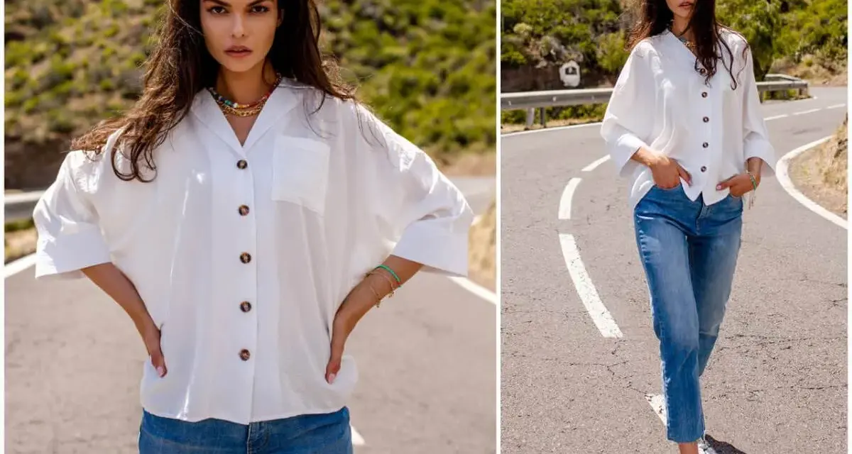 Modelka prezentuje, jak nosić koszulę damską do spodni. Biała, luźna koszula i jeansy tworzą stylowy, casualowy look.