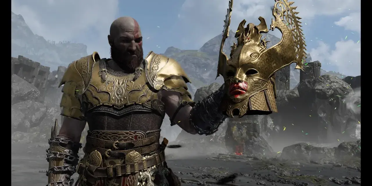 Kratos, el dios de la guerra, sostiene una máscara dorada de valquiria.