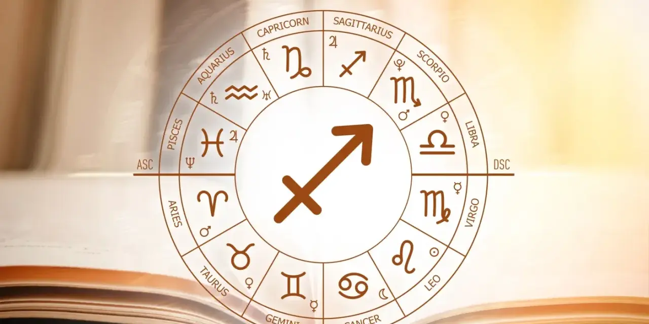 Koło zodiaku z symbolem strzelec znak zodiaku w centrum, na tle otwartej księgi.