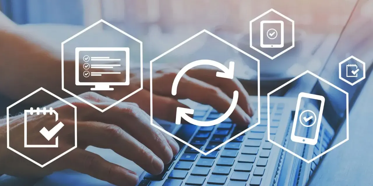 Hands typing on a laptop, surrounded by icons representing tasks, updates, and mobile access, suggesting a digital board portal for efficient management.