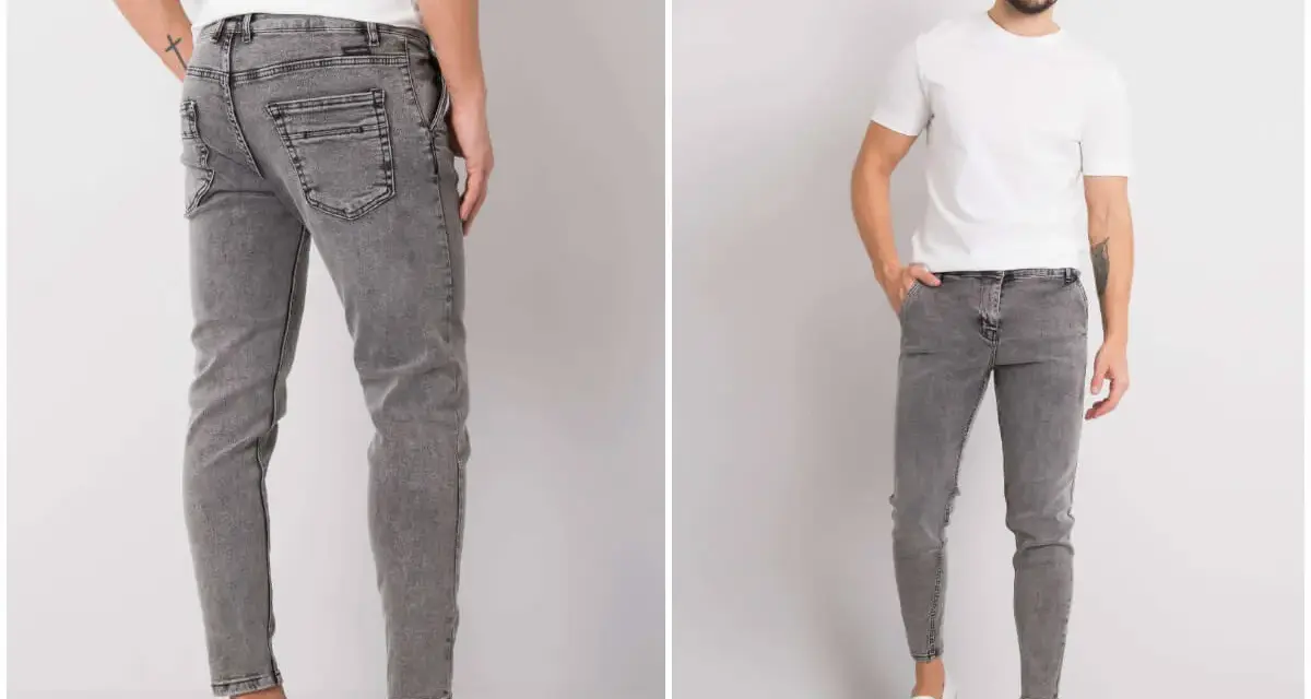 Szare jeansy męskie z przetarciami, dopasowane, z białym t-shirtem i białymi slip-onami.