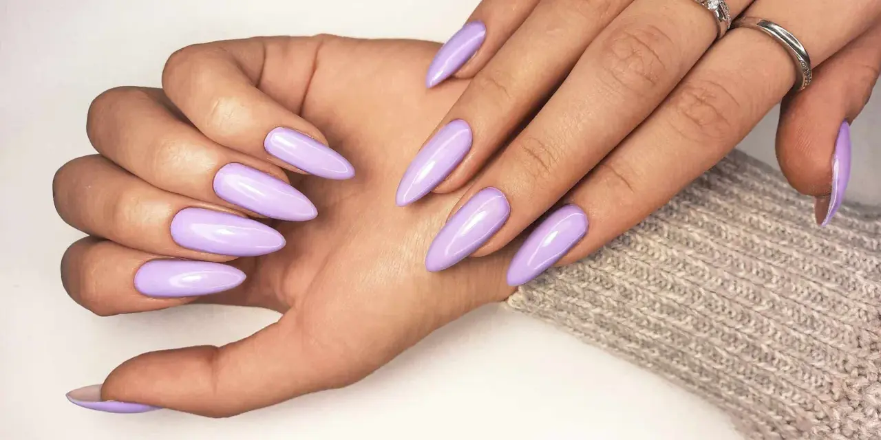 Beautiful lavender acrylic nails, a stylish choice that proves acrylic doesn't have to be expensive.
