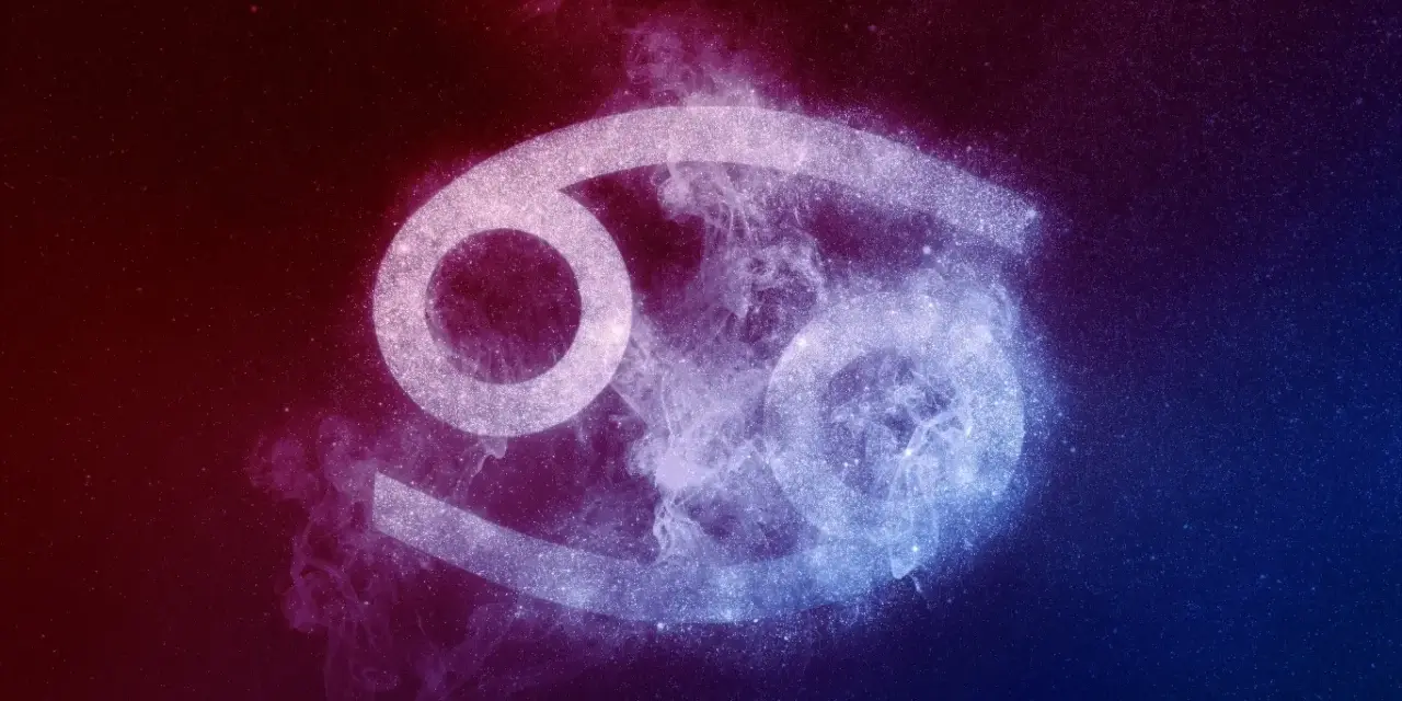 Symbol Raka, 23 czerwca znak zodiaku, otoczony kosmiczną mgławką w odcieniach czerwieni i błękitu.
