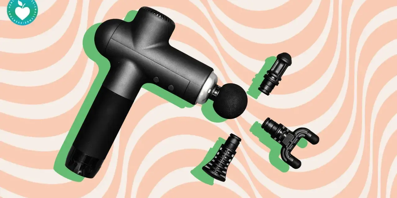 Black massage gun with interchangeable heads, hinting at the massage gun benefits study.
