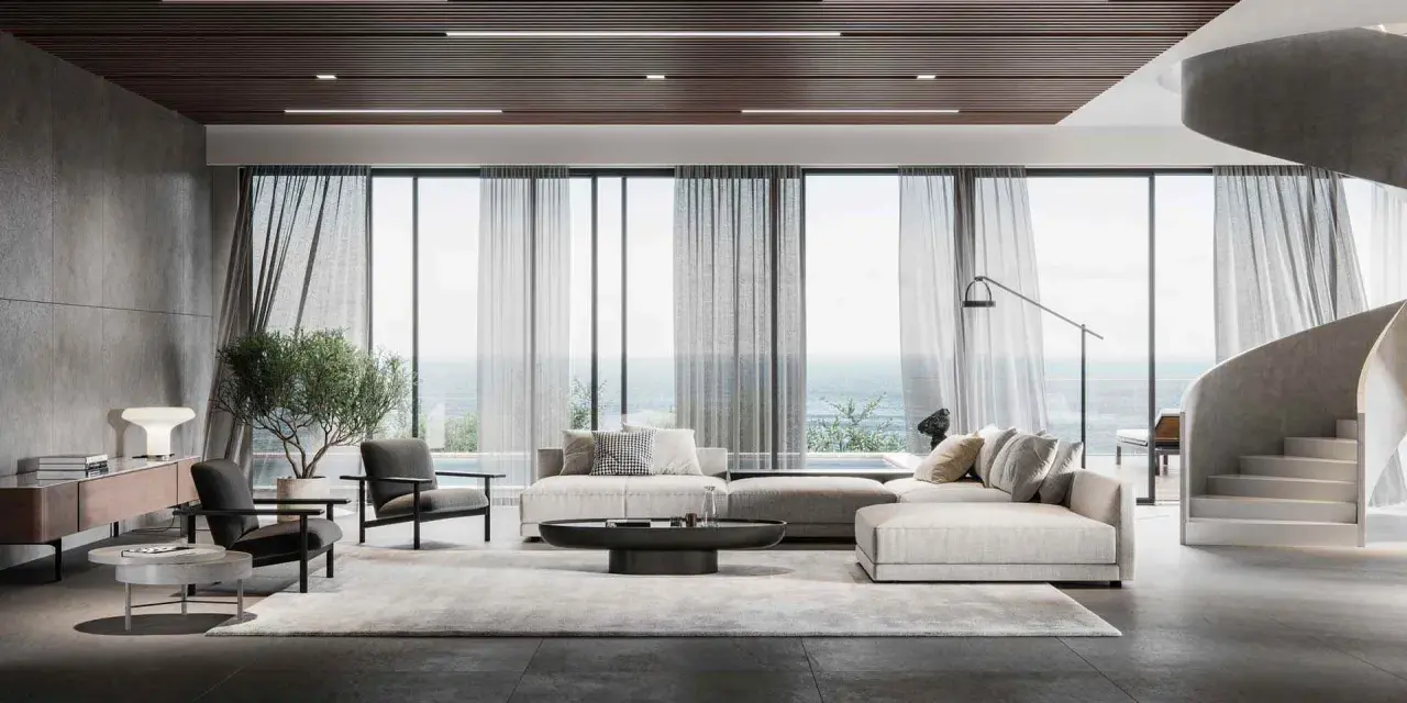 Soggiorno moderno con divano componibile, poltrone, tavolino e vista mare. L'arredamento evoca l'eleganza delle case stile americano, con linee pulite e materiali pregiati.