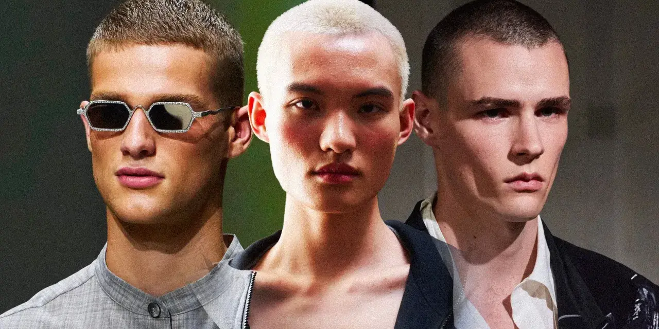 Tre uomini con taglio buzz cut uomo, uno con occhiali scintillanti, uno con capelli biondo platino e uno con sguardo intenso.