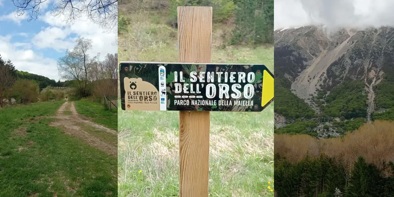 Segnale del sentiero dell'orso nel Parco Nazionale della Maiella, con un sentiero sterrato e montagne sullo sfondo.