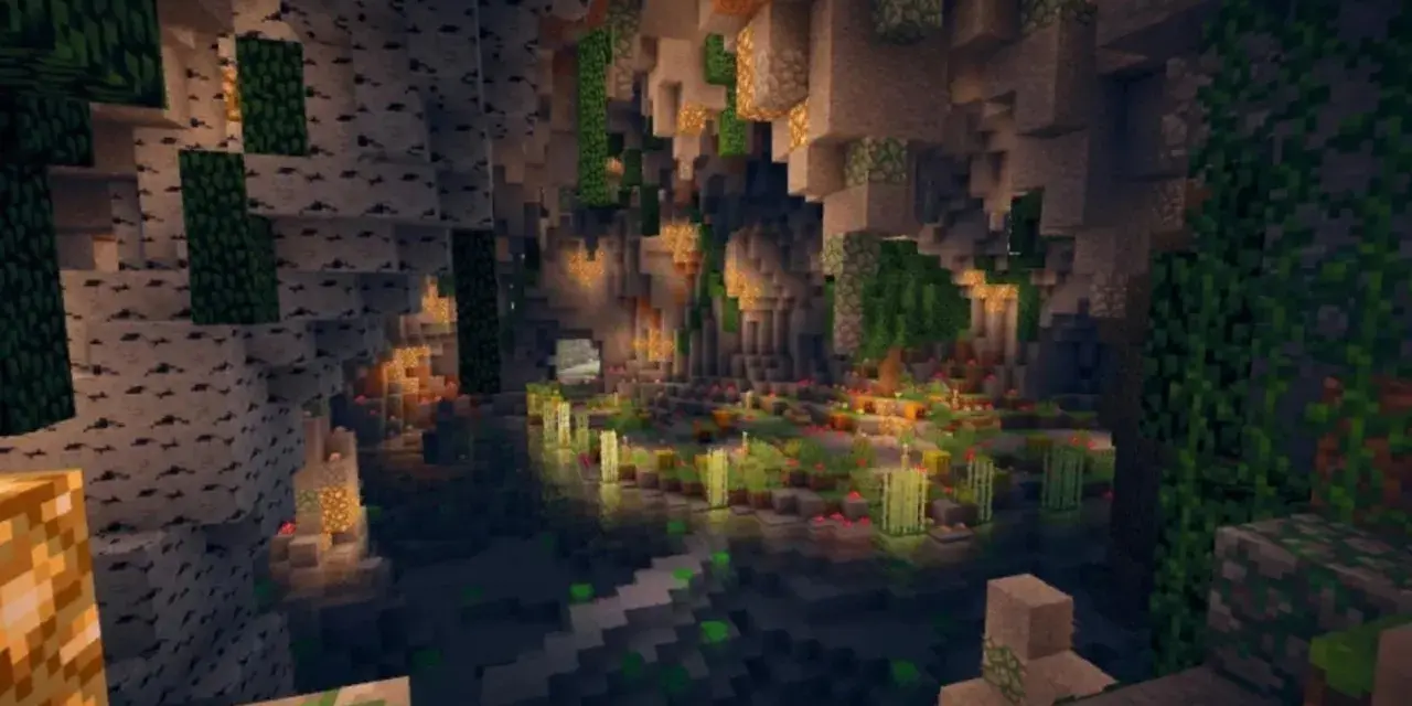Un mundo subterráneo de Minecraft con cascadas, vegetación exuberante y luces brillantes. ¡Una de las mejores semillas Minecraft para explorar!